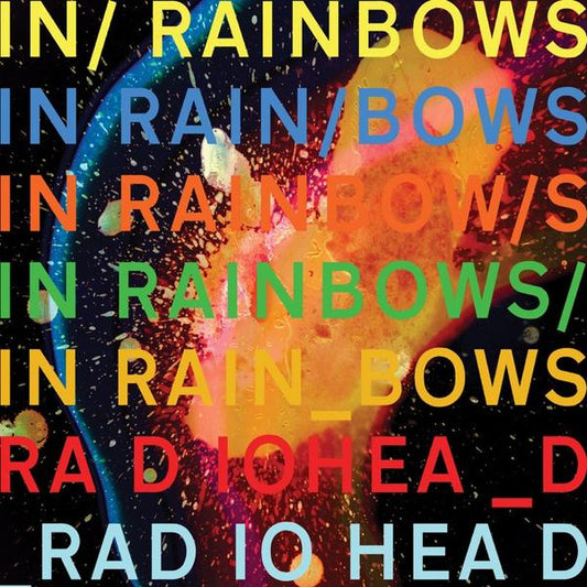 Album cover for Radiohead’s ’In Rainbows’ featuring colorful text repeating the album and band name.