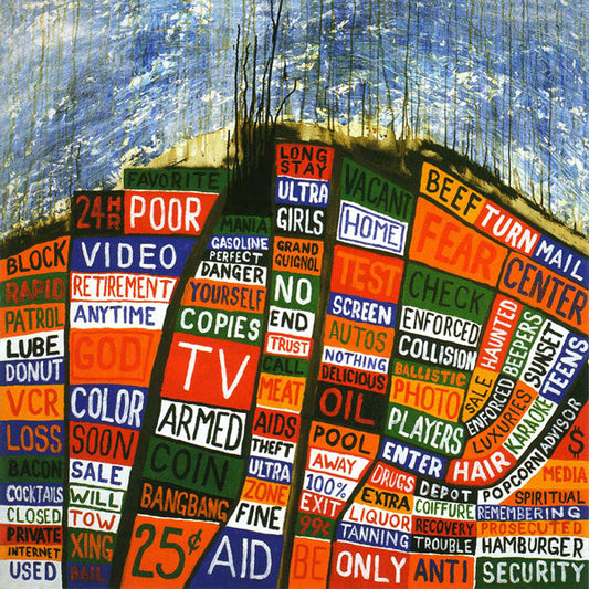 Colorful collage of text and words arranged in an abstract, circular pattern.
