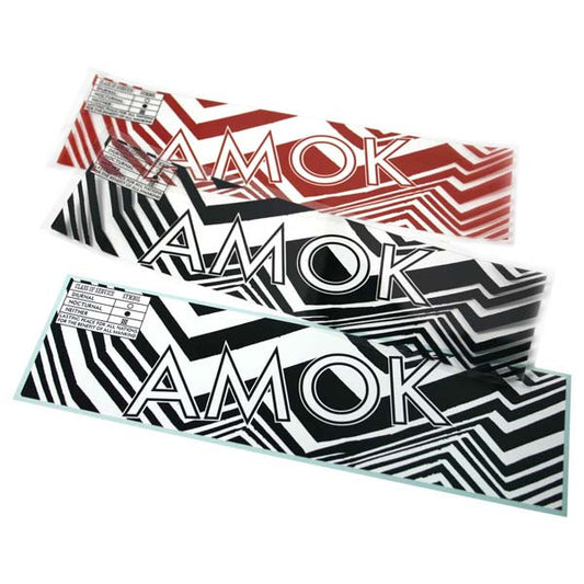 Three skateboard decks with ’AMOK’ branding and geometric patterns in different color schemes.