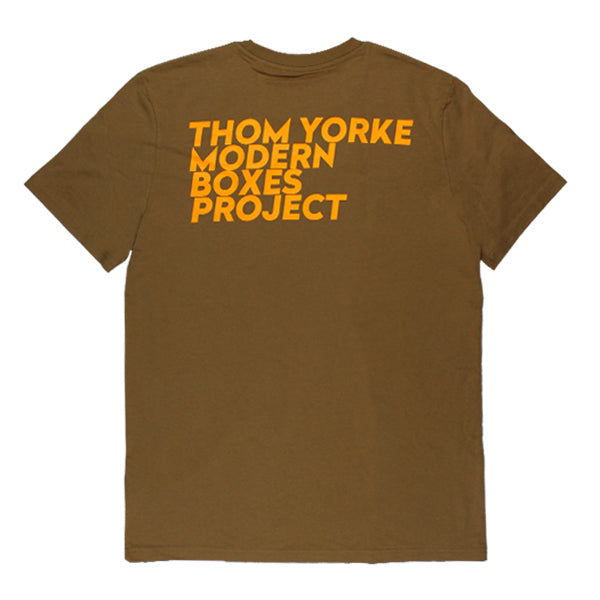 Brown t-shirt with yellow text reading ’THOM YORKE MODERN BOXES PROJECT’.