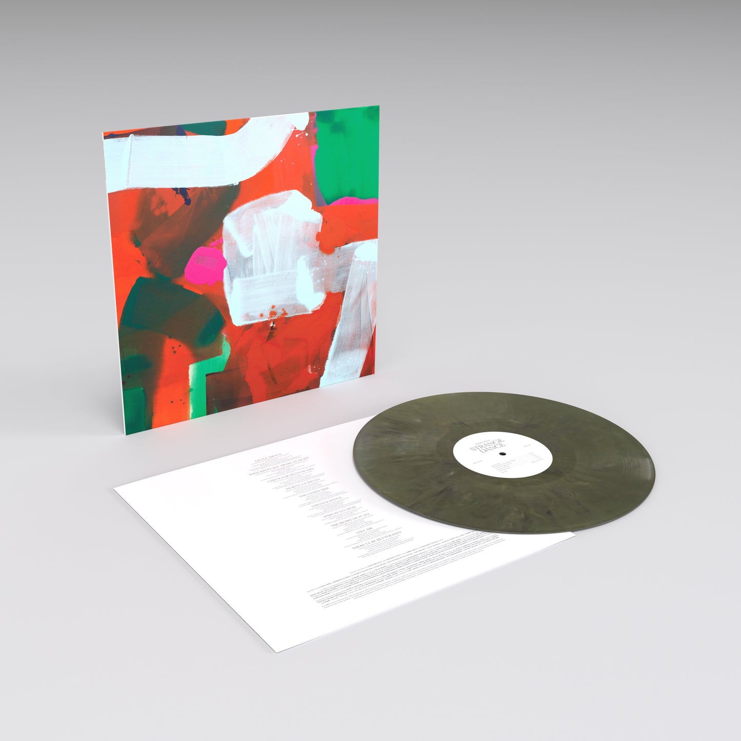 Vinyl record album with colorful abstract artwork on the cover.