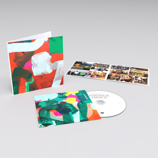 CD album package with colorful abstract artwork on the cover and a visible disc inside.