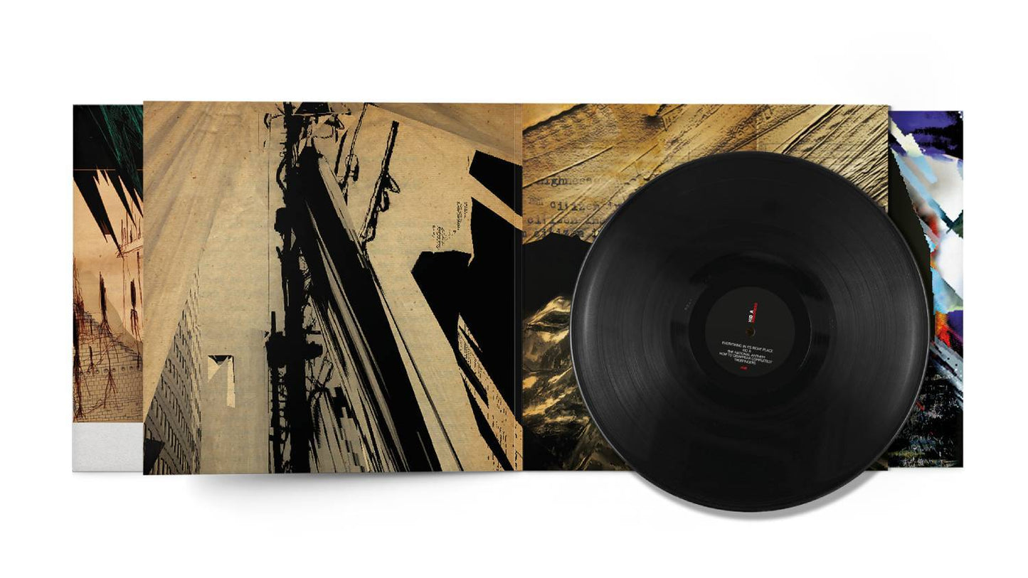 Black vinyl record on a wooden surface.