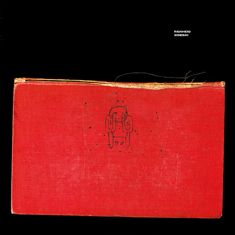 Red book or notebook with a simple sketch on its cover.