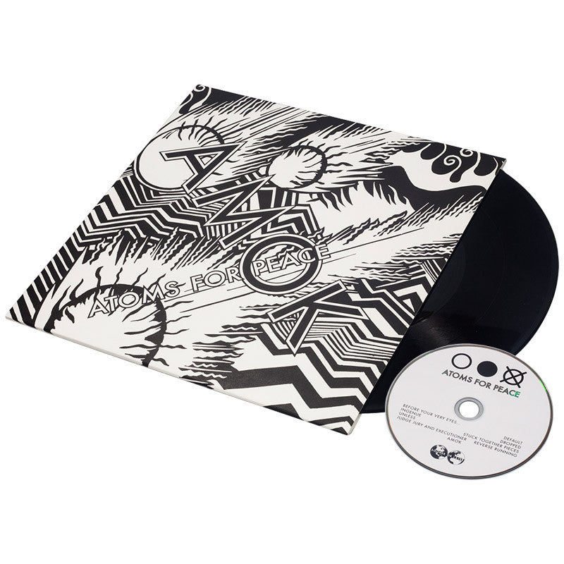Vinyl record album with abstract black and white artwork on its sleeve, accompanied by a CD.