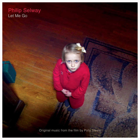 Album cover featuring a young child in a red sweater looking up at the camera.