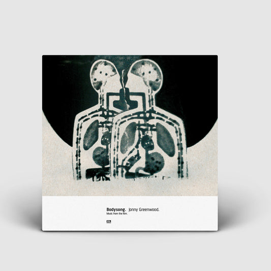 Album cover featuring a stylized X-ray-like image of two human figures.