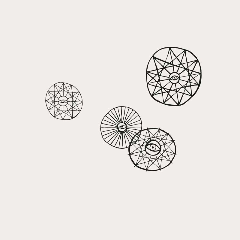 Four circular geometric designs featuring intricate line patterns and eye-like symbols.