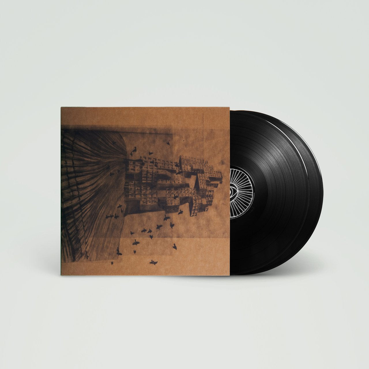 Vinyl record album with a sepia-toned cityscape cover art.