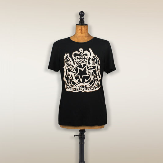 Black t-shirt with a white heraldic crest design on the front, displayed on a dress form.